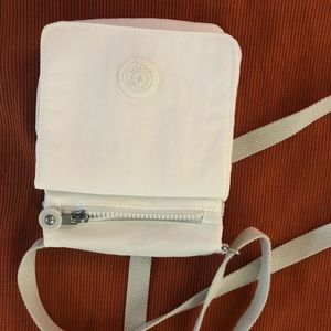 White Kipling many pockets!